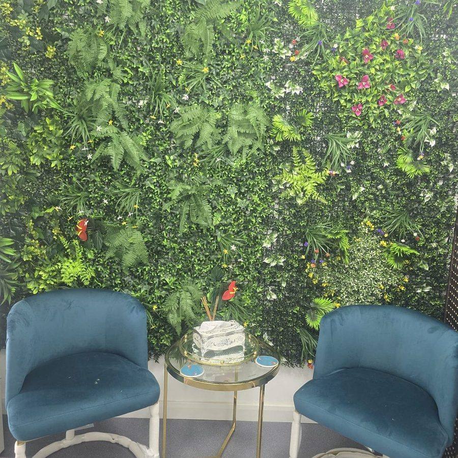 Reception seating in front of the living plant wall