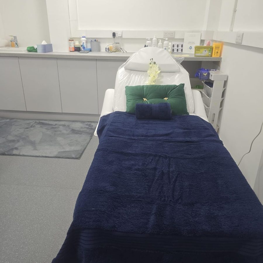 A treatment bed prepared for a facial appointment